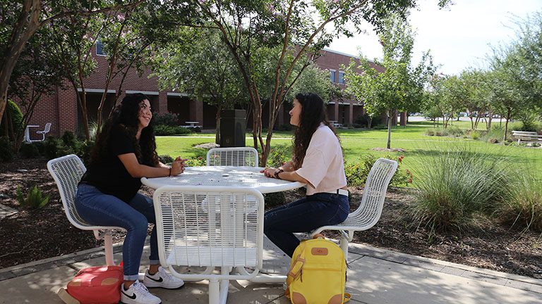 Two Girls Sitting and Talking